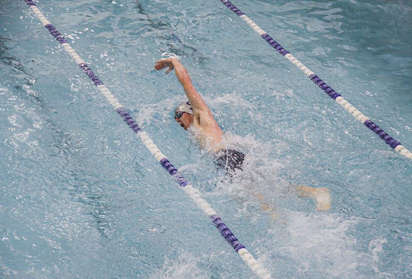 Boy swimmer racing